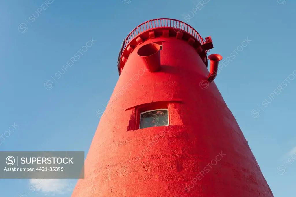 Lighthouse on sea wall protecting harbour entrance, Poolbeg Lighthouse, Great South Wall, Dublin Port, Dublin Bay, Ireland, november