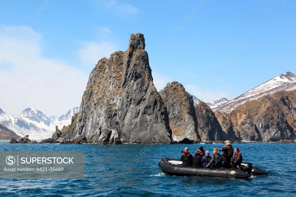 Zodiac inflatable boat with tourists at sea, Kamchatka Peninsula, Kamchatka Krai, Russian Far East, Russia, june