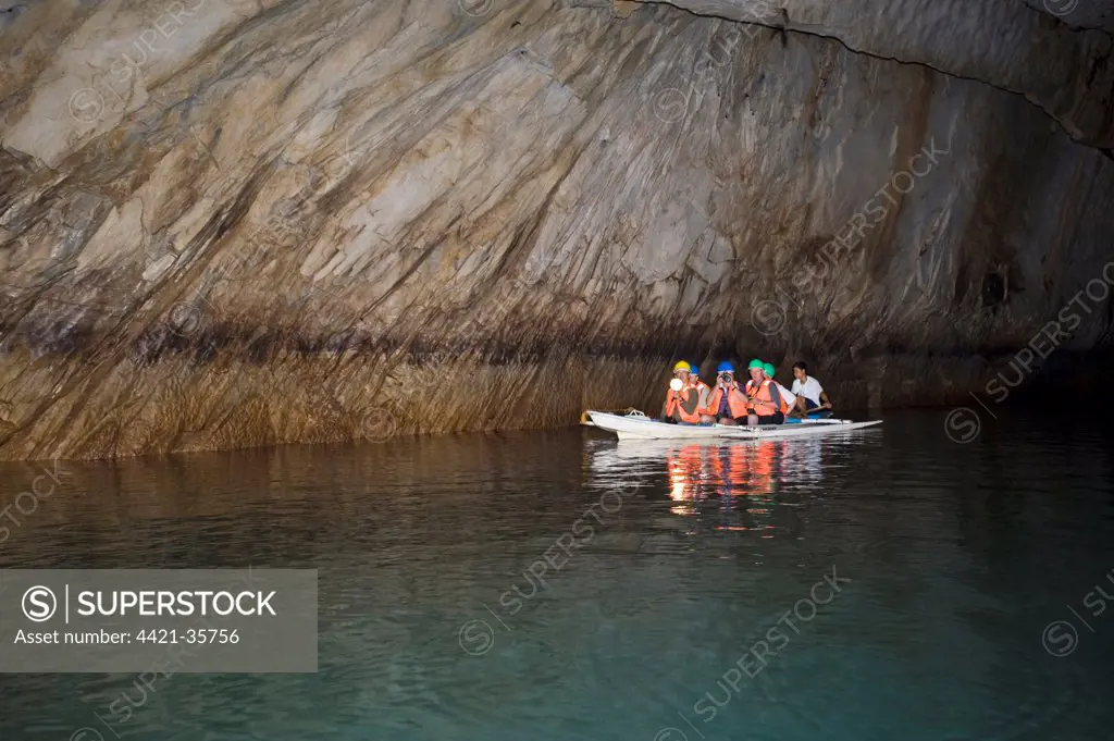 Tourist boat in cave on subterranean river, Puerto Princesa Subterranean River N.P., Saint Paul Mountain Range, Palawan Island, Philippines