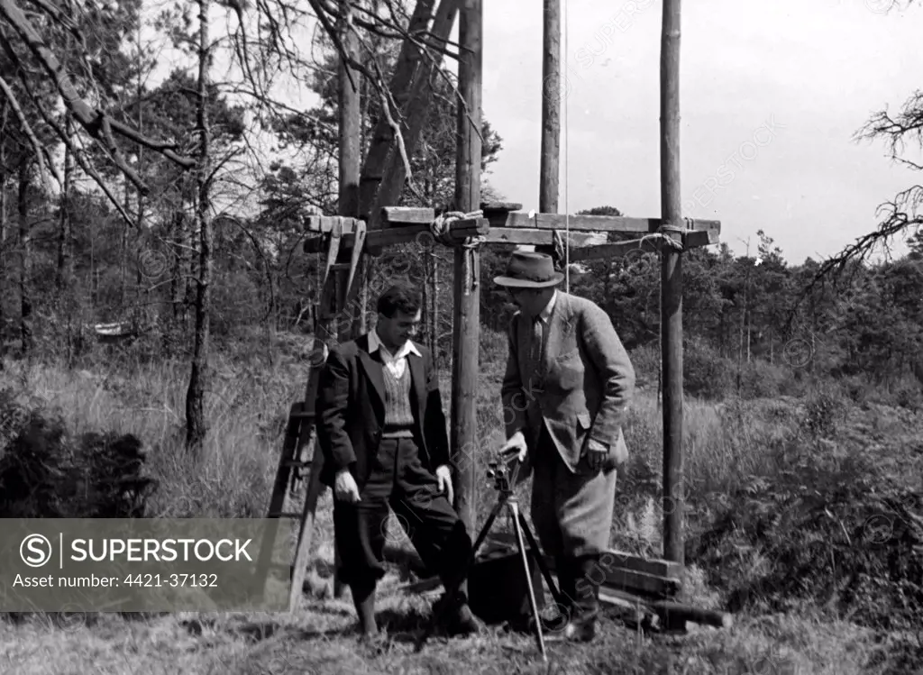 Eric Hosking(left) with Lord Alanbrooke by a pylon hide used to photograph a Hobby nest 1945.