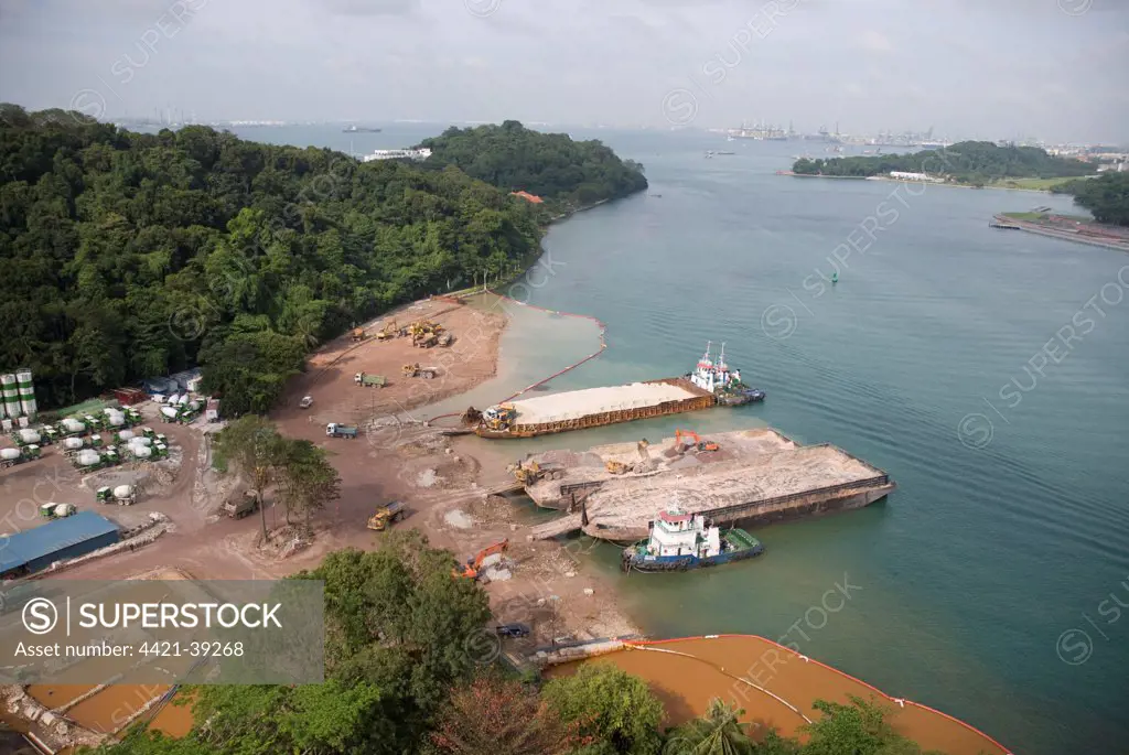 View of coastal land reclamation and barges, Sentosa Island, Singapore