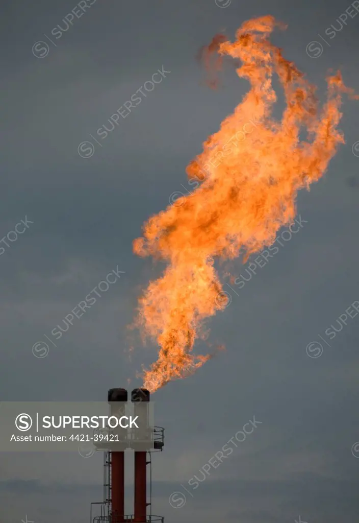 Gas flare from chimney, Tangguh LNG (Liquified Natural Gas) Plant, Bintuni Bay, West Papua (Irian Jaya), Indonesia