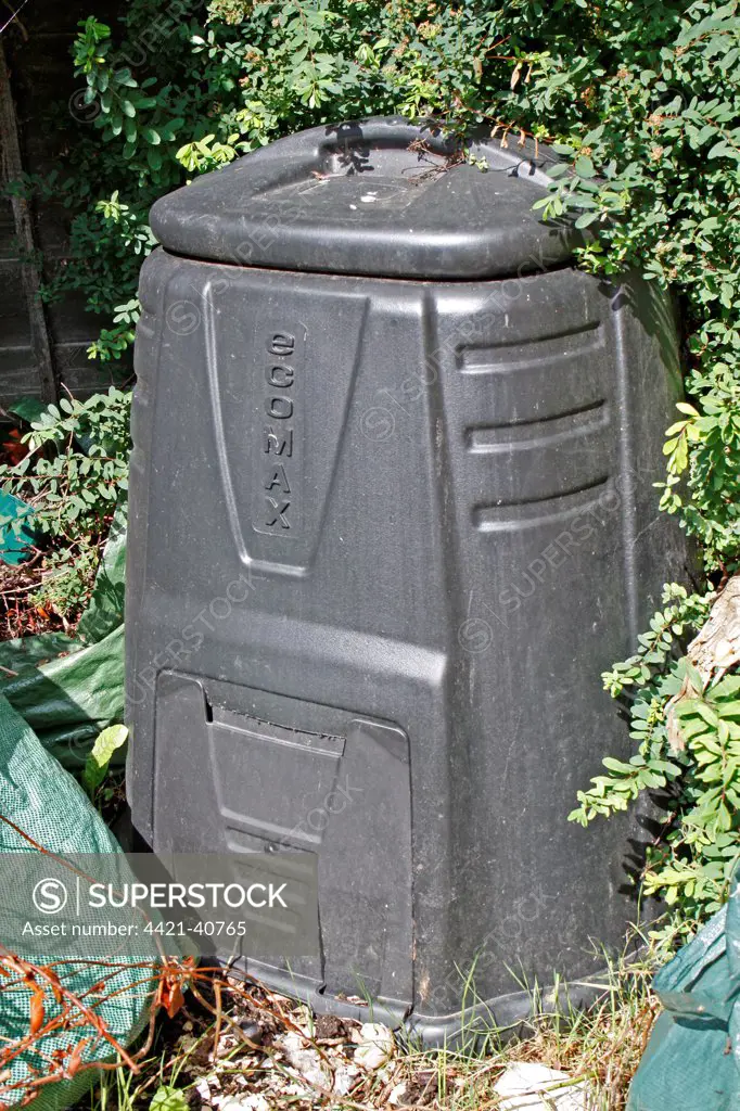 Plastic compost bin in garden, Suffolk, England, august