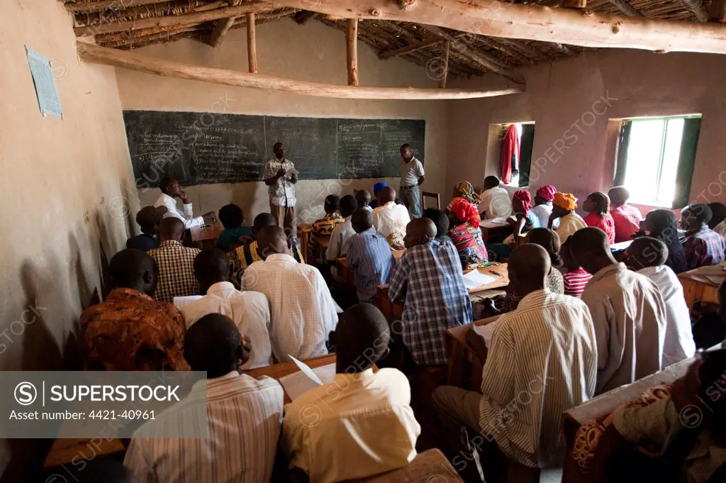 Classroom full of adult students learning about sustainalble agriculture, Rwanda