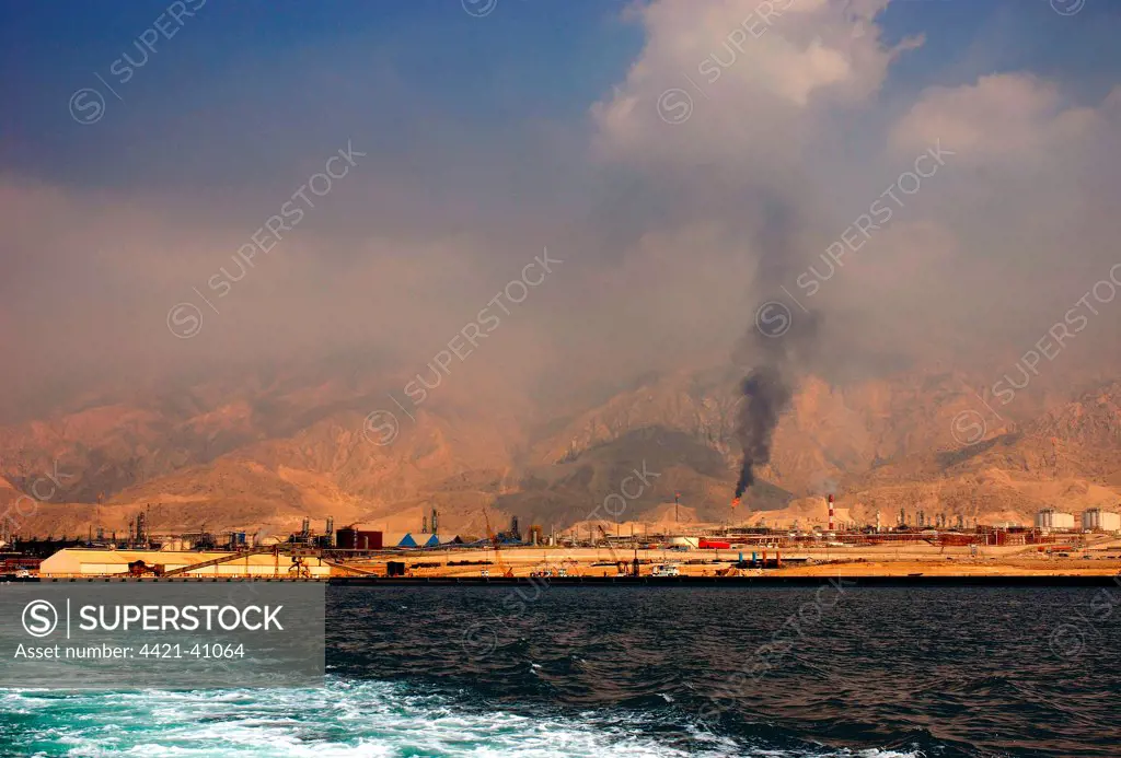 View of port and oil refineries, Zagros Mountains in distance, Assalouyeh, Pars Special Energy Economic Zone, Persian Gulf, Southern Iran