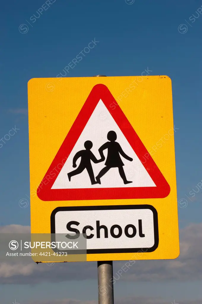 'School' ahead warning road sign, England