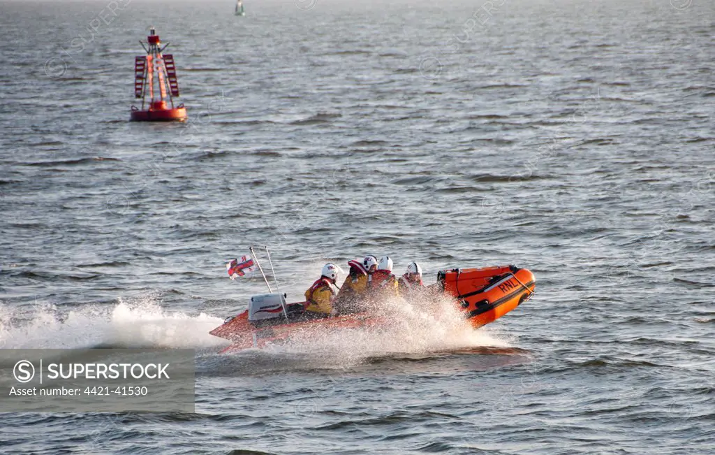 RNLI D-class inflatable lifeboat in harbour entrance, Dublin Port, Dublin Bay, Ireland, november