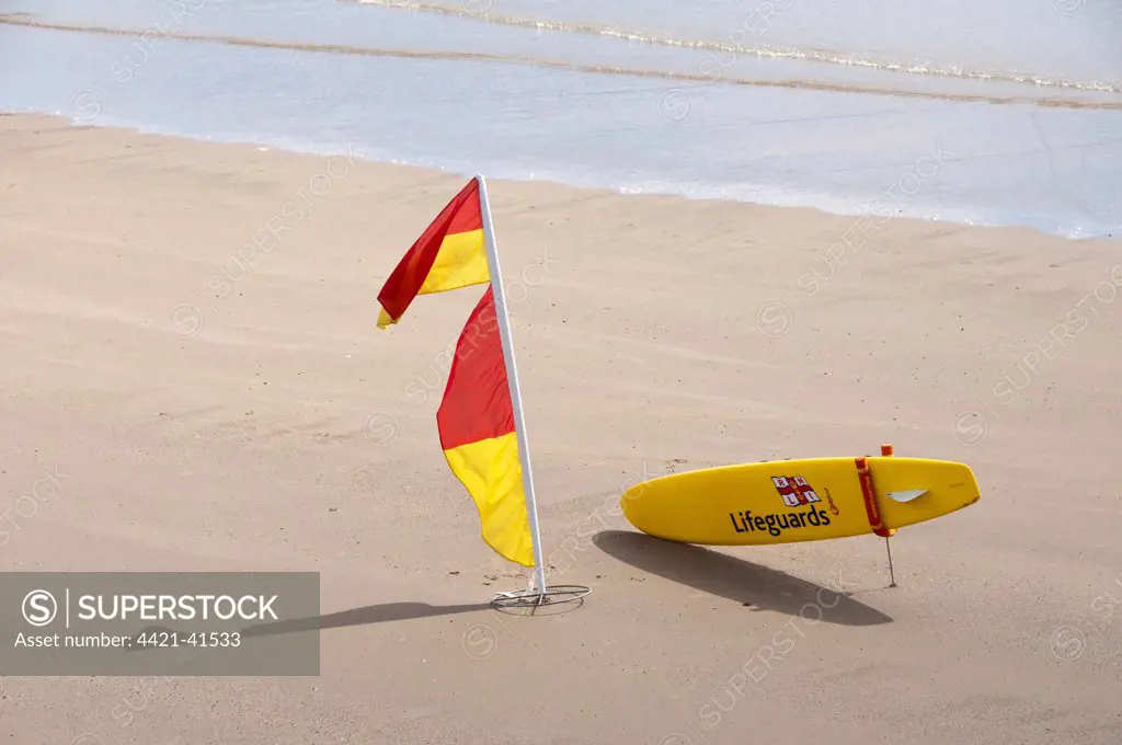 RNLI Lifeguard equipment and flag on beach, Filey, North Yorkshire, England, july