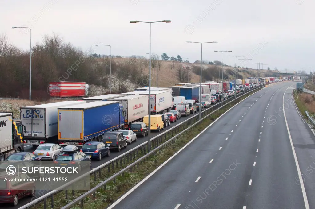 Congested motorway with cars and lorries, M20 Motorway, Kent, England, winter