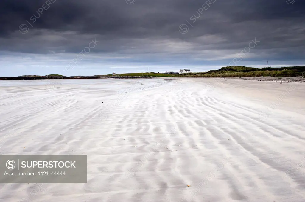 View of wave patterns on sandy beach and stormclouds, Salum, Isle of Tiree, Inner Hebrides, Scotland, August