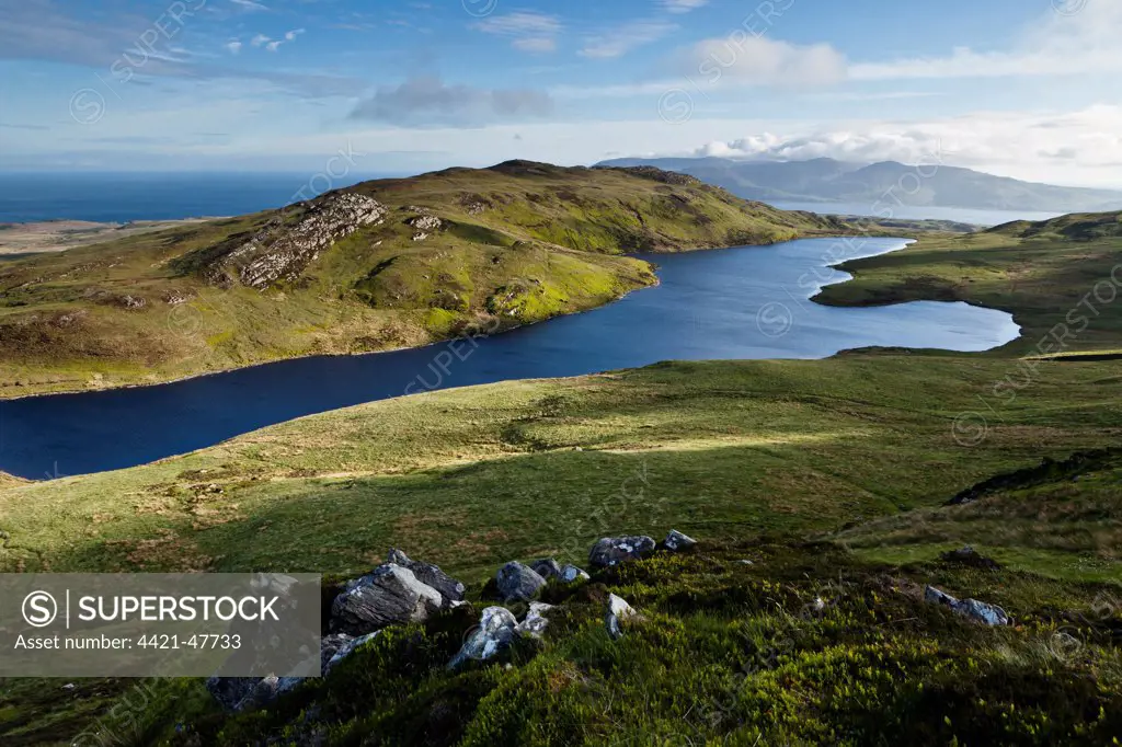 View of freshwater loch and coastline, viewed from halfway up Dubh Bheinn across east coast of Islay, Loch a Bhaile-Mhargaidh (Market Loch), Isle of Jura, Inner Hebrides, Scotland