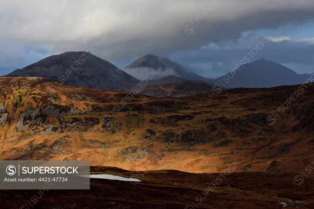 View of mountain peaks, Beinn a' Chaolais, Beinn an Oir and Beinn Shiantaidh, Paps of Jura, viewed from Dubh Bheinn, Isle of Jura, Inner Hebrides, Scotland