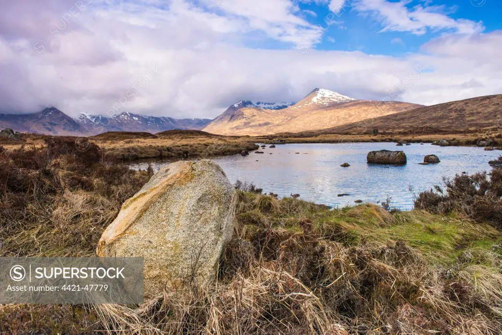 View of moorland landscape with freshwater loch, Loch nah-Achlaise in foreground with Clach Leathad and Stob Ghabhar peaks in background, Rannoch Moor, Grampians, Highlands, Scotland, May