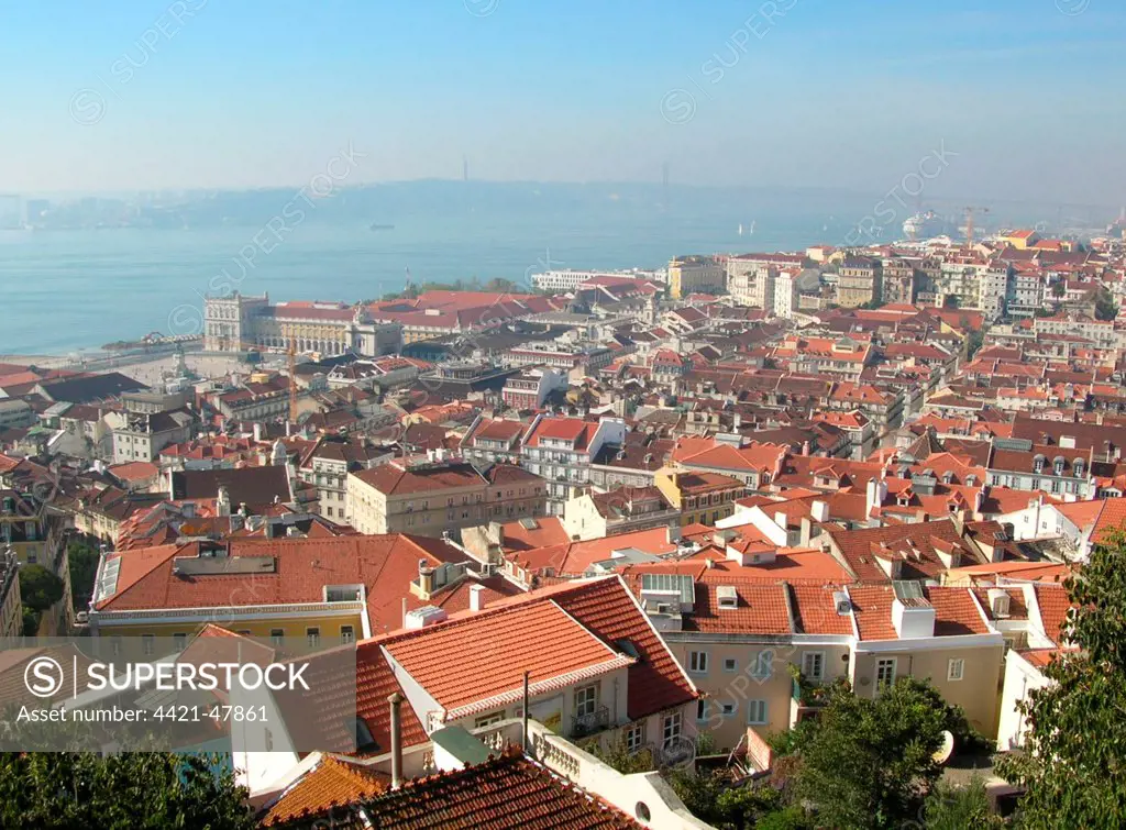 View across city rooftops from castle towards river, Tagus River, Lisbon, Portugal, October