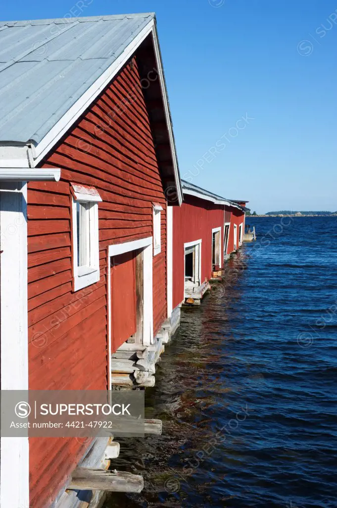 Boathouses in fishing village, Trollharens, Gastrikland, Norrland, Baltic Sea, Sweden, august