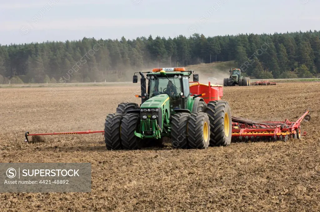 John Deere 8530 tractor, drilling and harrowing field, Sweden, autumn