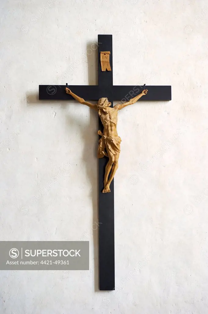 Crucifix on cathedral wall, Strangnas Cathedral, Sodermanland, Sweden, august