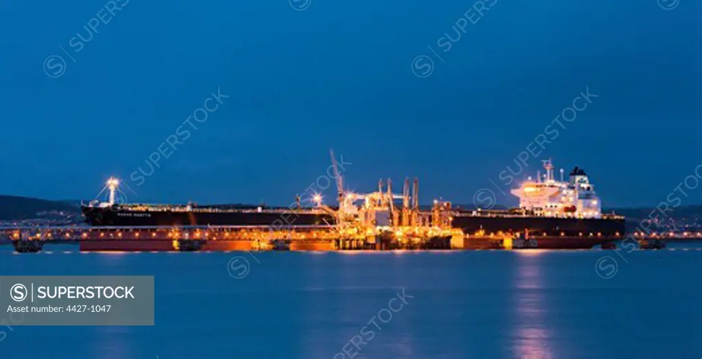 Oil tanker berthed at Hound Point on the Firth of Forth at night, Scotland