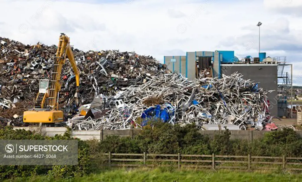 Piles of scrap metal with a crane, Scotland