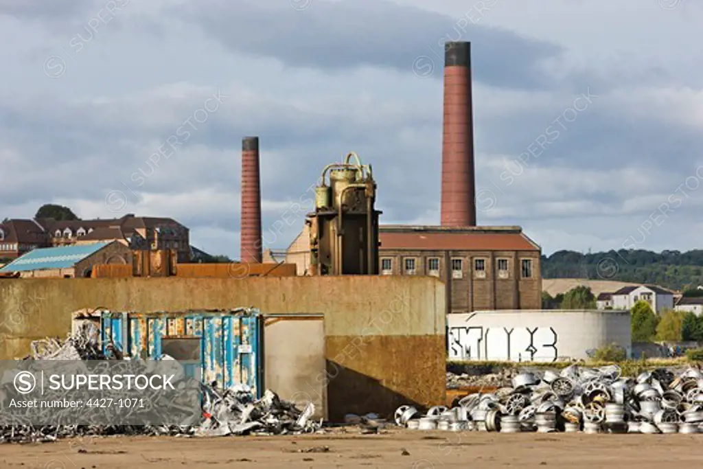 Recycling aluminum car wheels at an old industrial site, Inverkeithing, Fife, Scotland