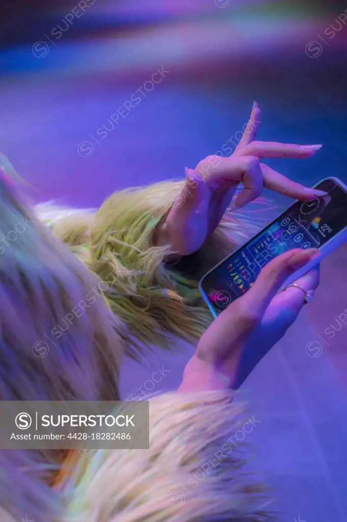 Close up stylish woman using smart phone