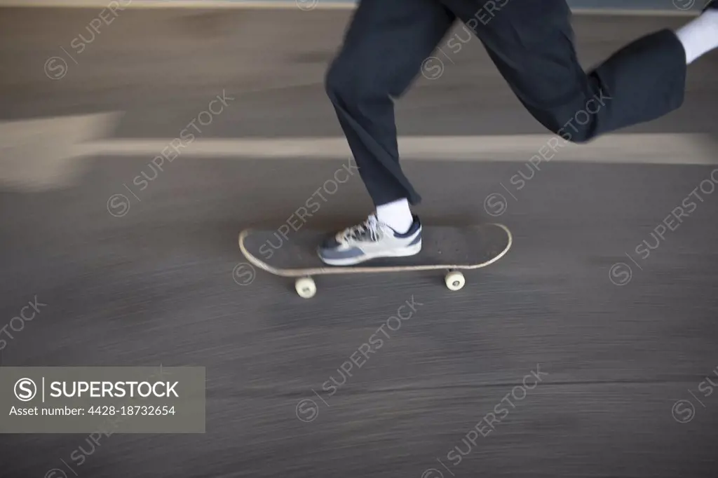 Boy skateboarding on street