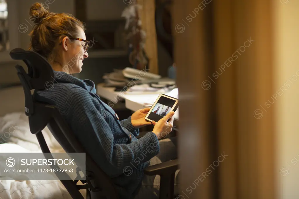 Woman working from home video chatting with coworkers digital tablet 
