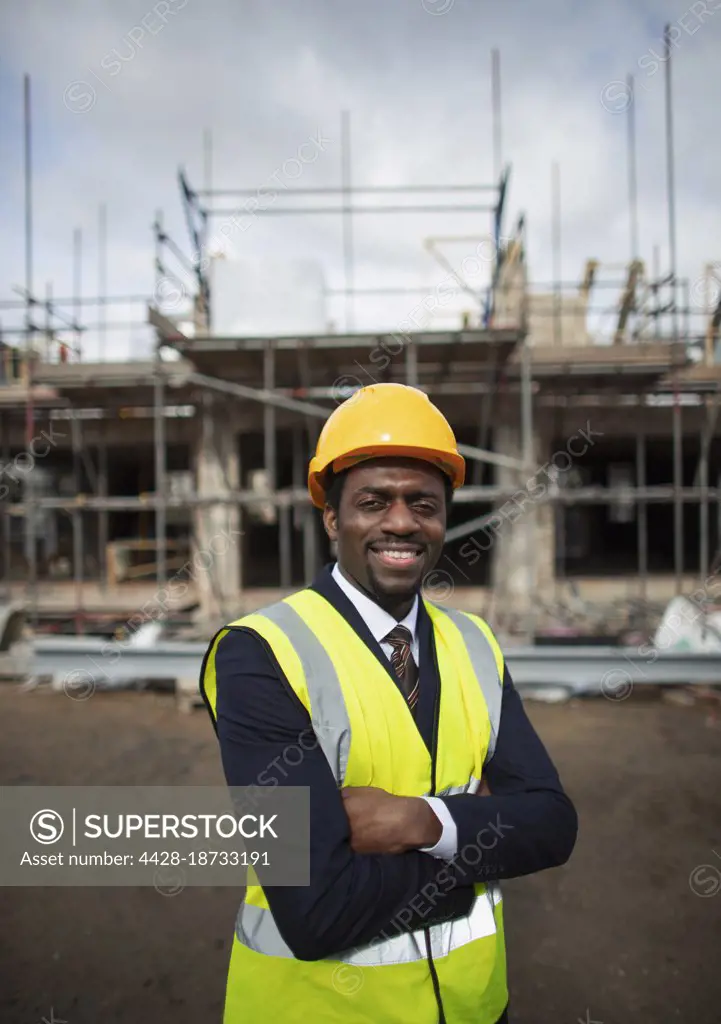 Portrait confident male architect at construction site