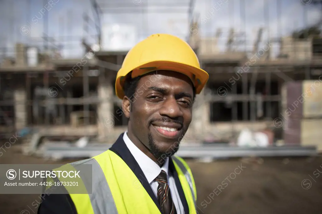 Portrait confident architect at construction site