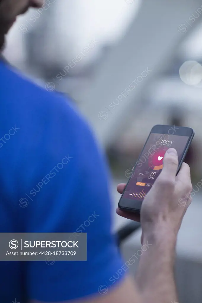 Man checking heart rate on smart phone app