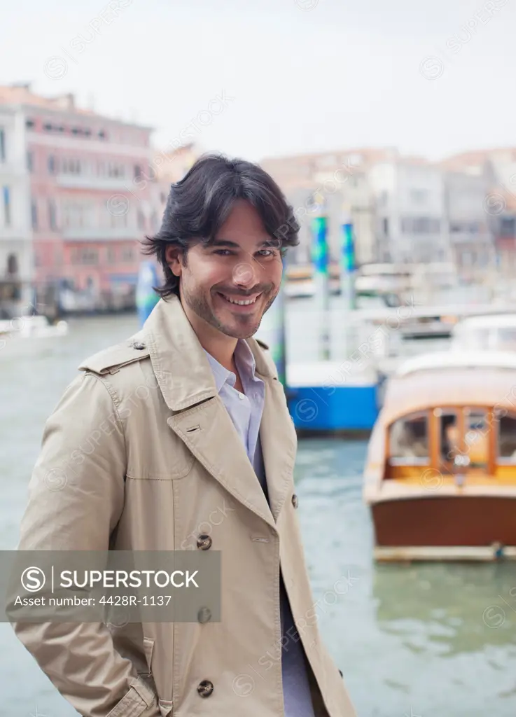 Venice, Portrait of smiling man at waterfront in Venice