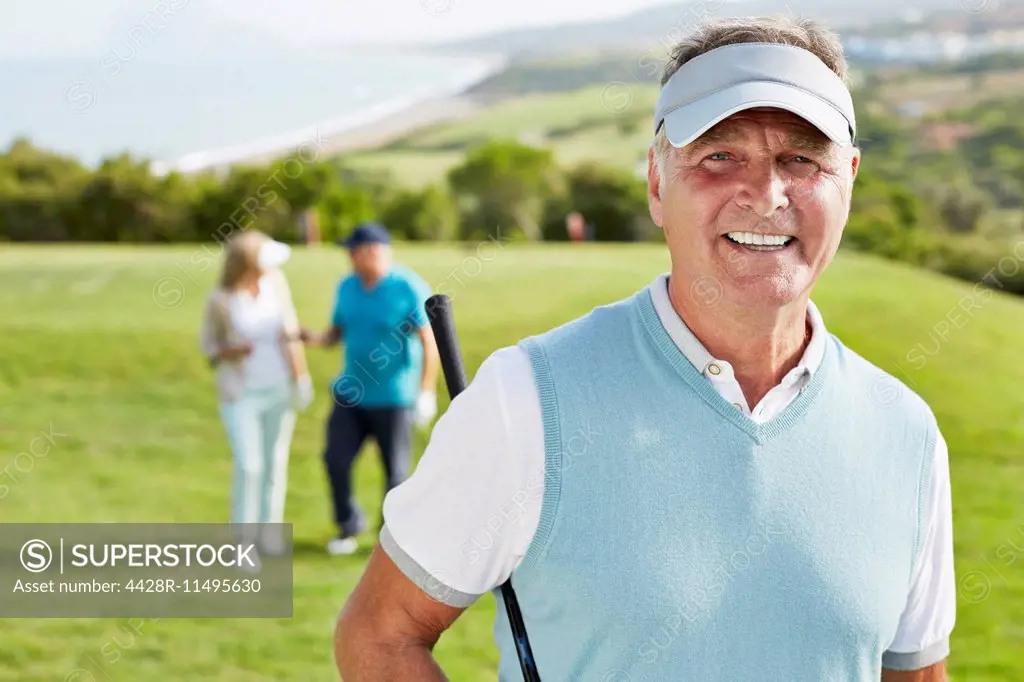 Smiling senior man on golf course