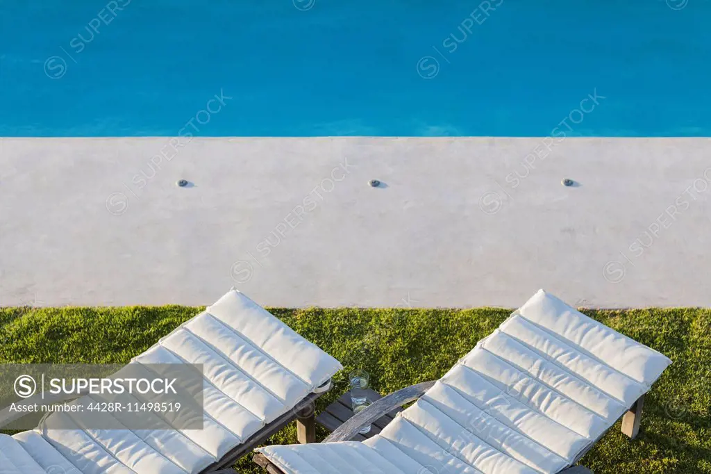 Lounge chairs at poolside