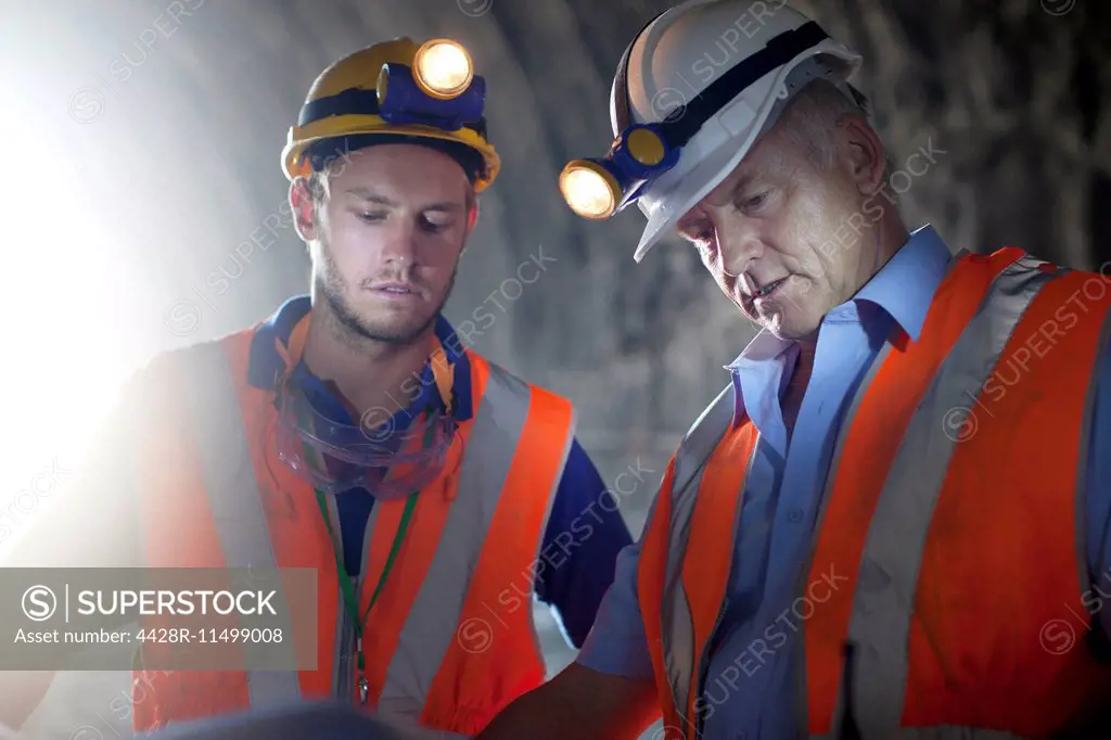 Workers talking in tunnel