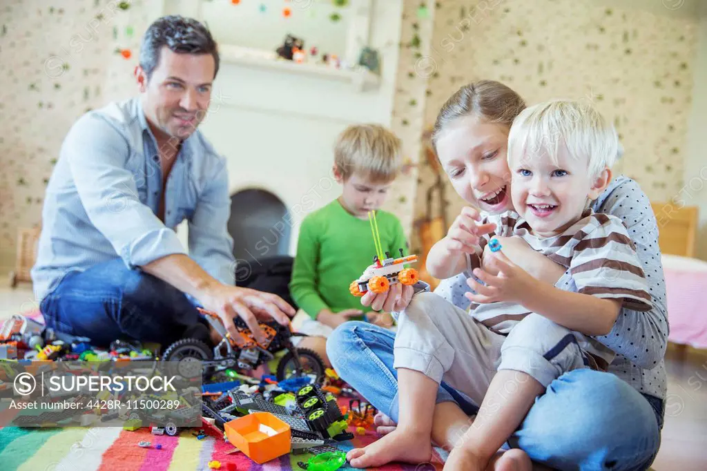 Father and children playing together
