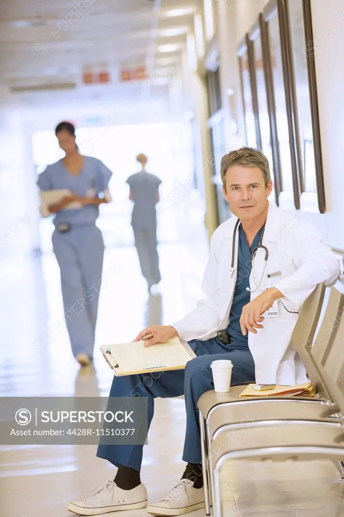 Portrait of serious doctor in hospital corridor