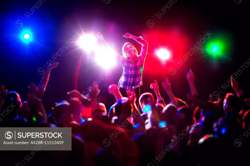 Woman dancing at concert
