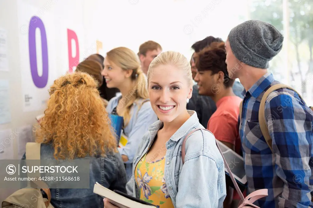 Smiling female student looking at camera