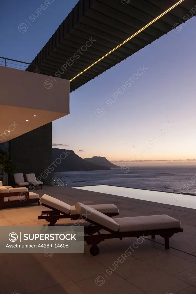 Balcony of modern house overlooking ocean at sunset, Cape Town, South Africa