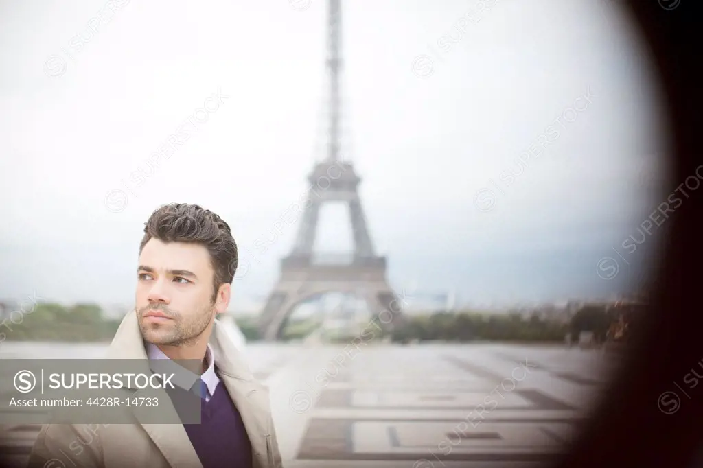Businessman standing near Eiffel Tower, Paris, France, Paris, France