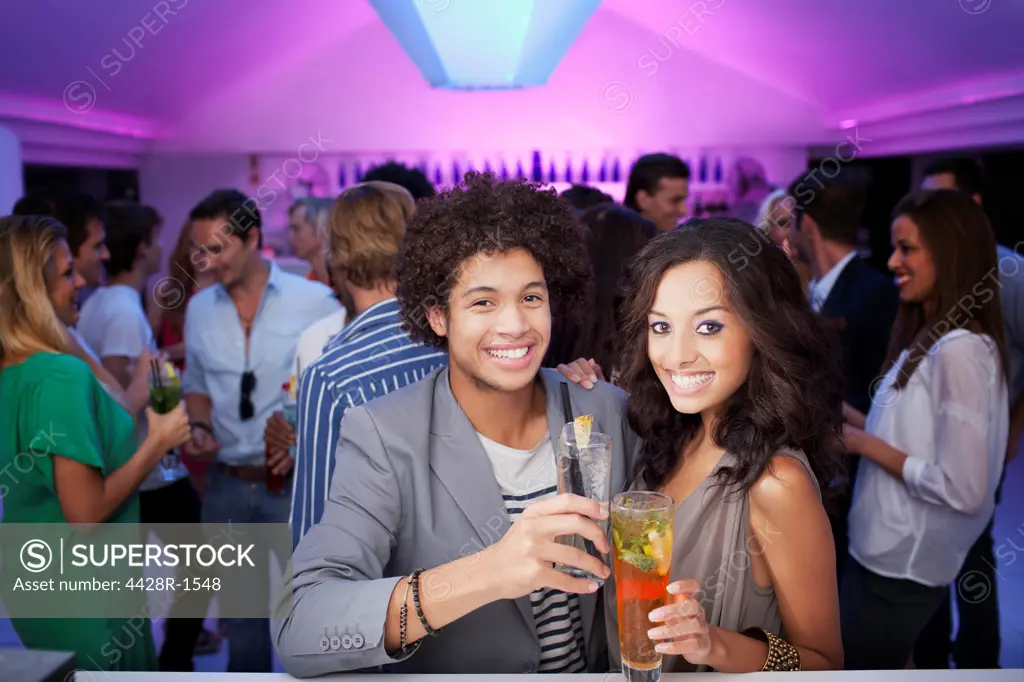 Cape Town, Portrait of smiling couple at bar of nightclub