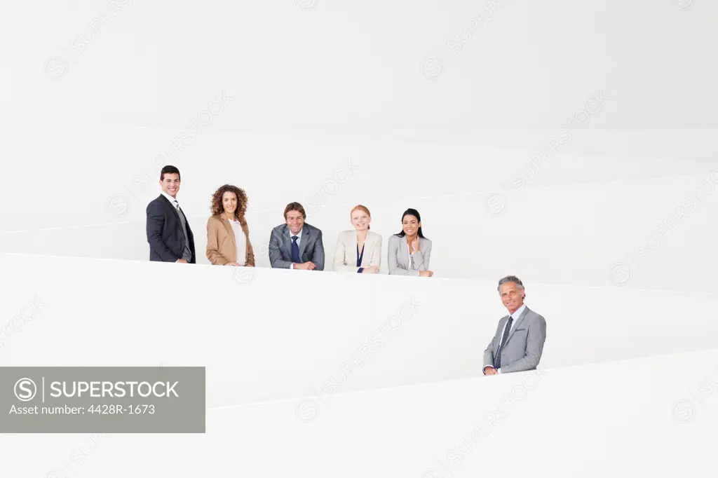 Spain, Portrait of confident business people standing on modern stairway