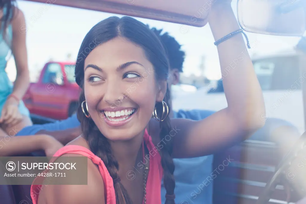 Los Angeles, USA, Smiling woman sitting in car