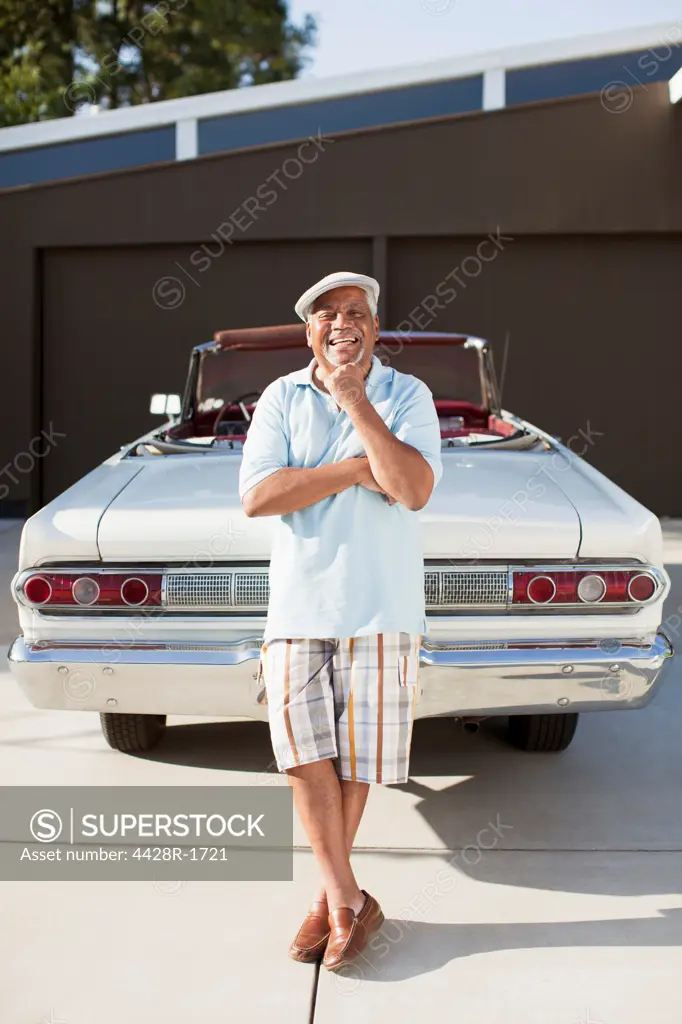 Los Angeles, USA, Smiling older man with convertible