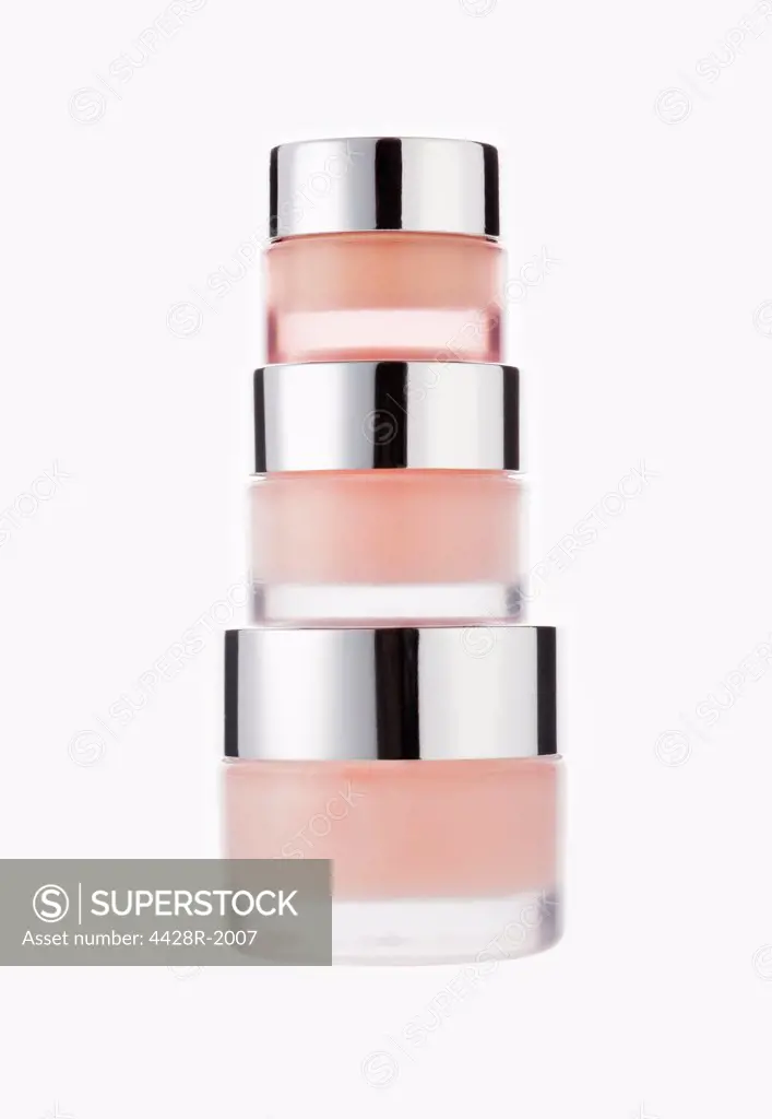 Three stacked jars of moisturizer