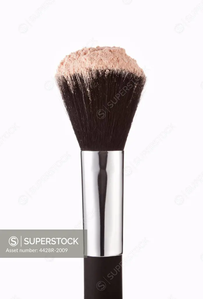 Close up of blush powder on makeup brush