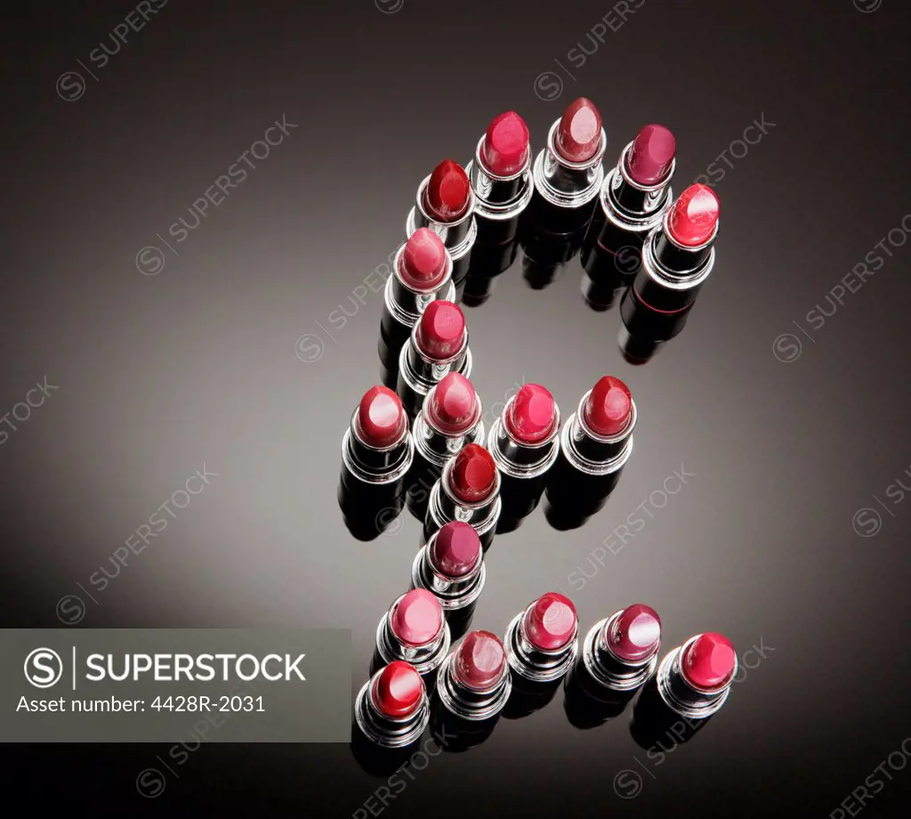 Multicolor lipsticks forming British pound symbol