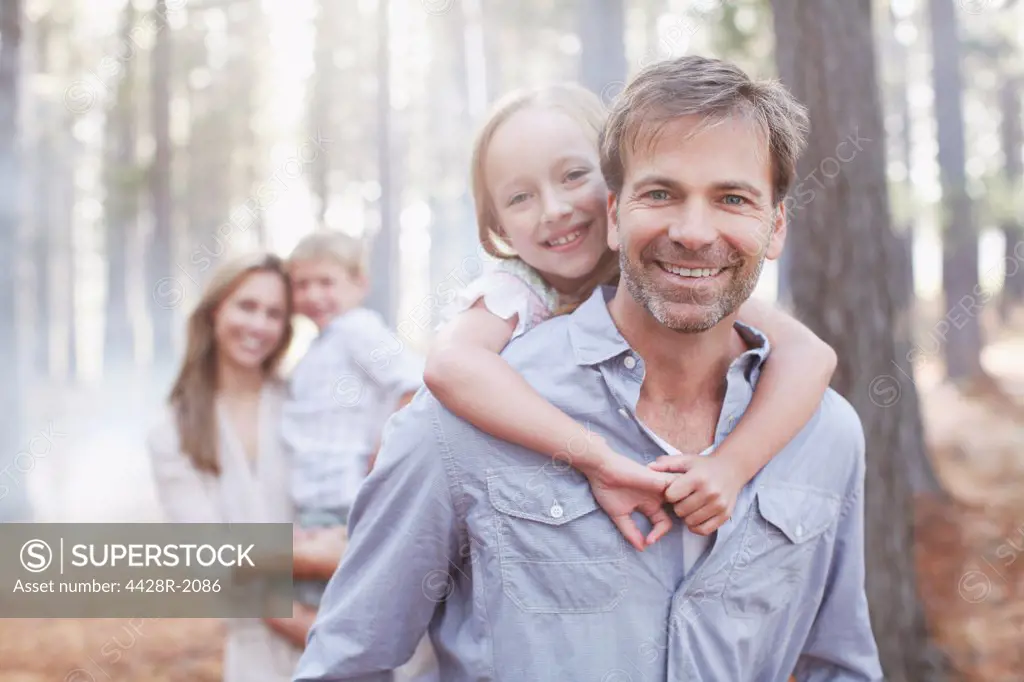 Cape Town, South Africa, Portrait of smiling family in woods