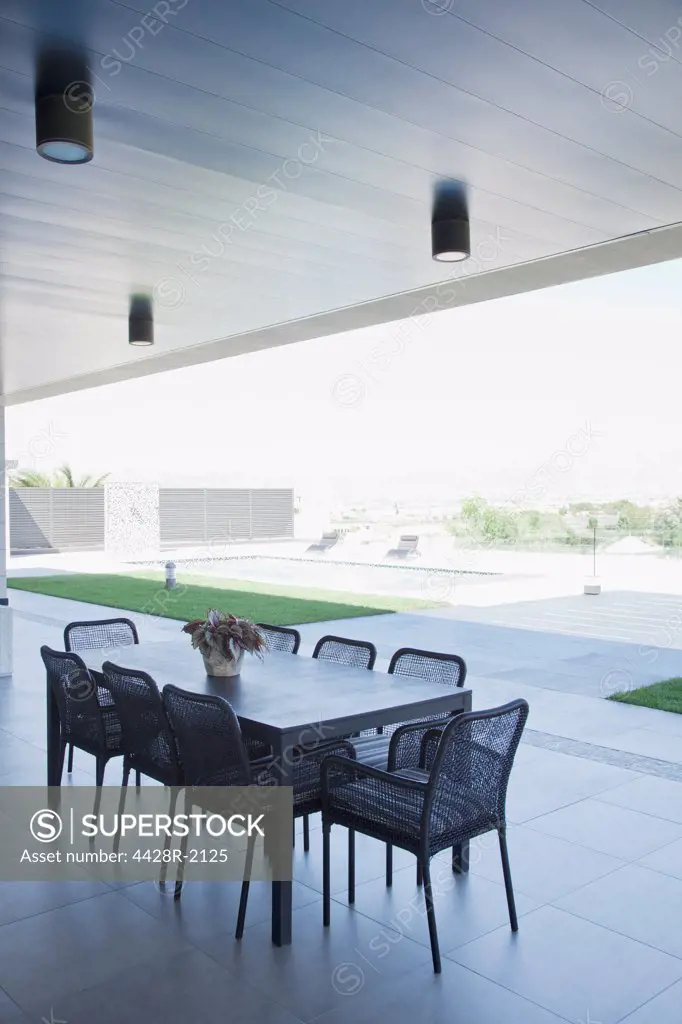 Spain, Table and chairs on patio