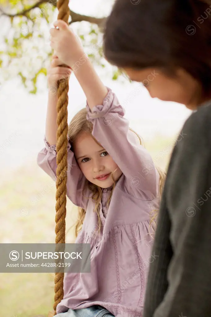 Cape Town, Portrait of girl on swing with mother